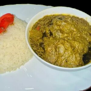 Cassava leaf stew with rice